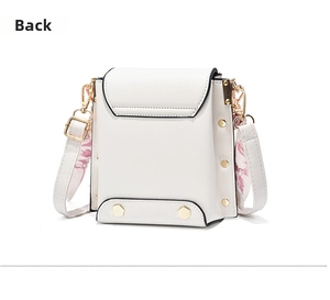 Back view of white leather crossbody bag with gold studs and pink silk scarf detail