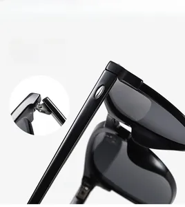 Detail view of premium polarized sunglasses featuring flexible hinges and glossy black finish