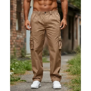 Men's khaki multi-pocket cargo pants in cotton canvas on a brick street background