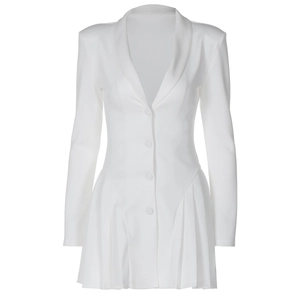 Detail showing the elegant ruffled hem and button closure of the white blazer dress