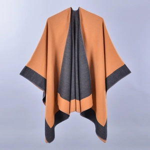 Orange and camel split-front knit poncho wrap for women with charcoal grey trim accents