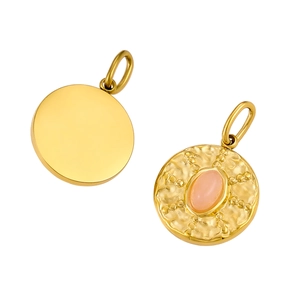 Detailed view of round gold pendants featuring hammered metal texture and pink gemstones
