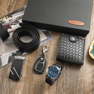Business gift set for men featuring a black watch, wallet, belt, and keychain in a premium box