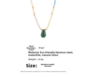 Detail view of malachite heart pendant on colorful beaded titanium steel necklace
