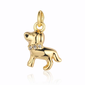 Detailed view of a golden dog pendant with zircon stones around the neck on white background