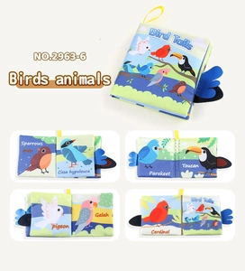 Detail showing colorful soft cloth book with 3D bird tails for infant sensory early learning