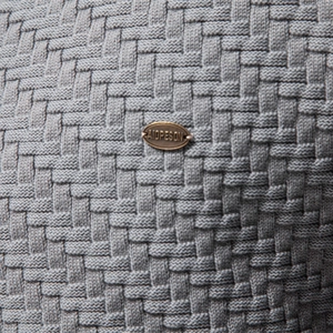 Men's V-neck knit cardigan with gray textured checkerboard pattern and metal logo plate