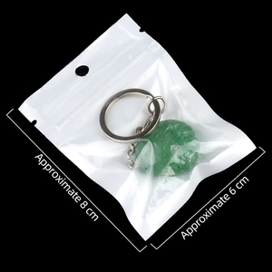 Natural green agate stone footprint pendant keychain with metal ring in packaging