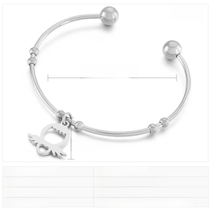 Macro detail of stainless steel bangle with dimensions and heart wing charm specifications