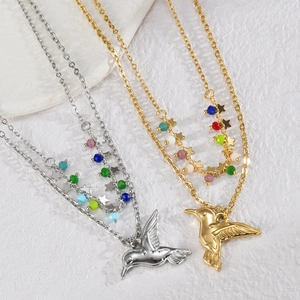 Double layered gold and silver hummingbird necklace with star charms and colorful beads