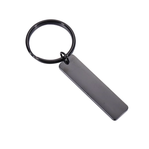 Polished black stainless steel rectangular tag keychain shown on a white background
