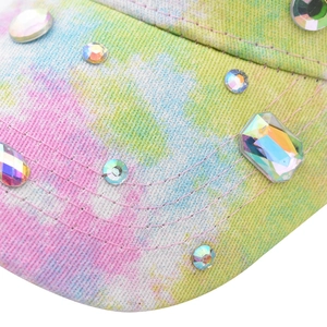 Detail of colorful tie-dye baseball cap with sparkling crystal rhinestones and fine stitching