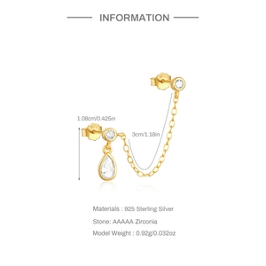 Detail of S925 silver gold-plated earring with cubic zirconia droplet and fine link chain