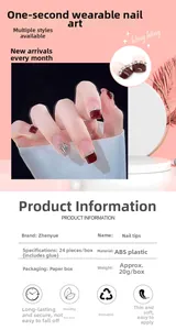 Detail of burgundy press-on nails with silver glitter and rhinestones in gift box packaging