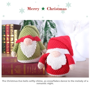 Detail of knitted Christmas gnomes with braided texture on a vintage book setting