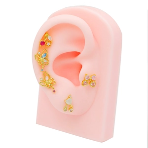 Gold cherry and butterfly stud earring set with colorful zircon on silicone ear model