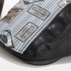 Detailed close-up of retro PU leather and striped canvas fabric on a newsboy cap