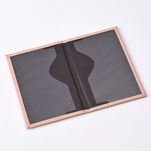 Open travel document holder featuring pink faux leather exterior and gray card slots