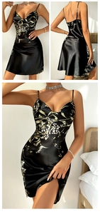 Detail of black floral satin sleepwear showing smooth texture and botanical patterns