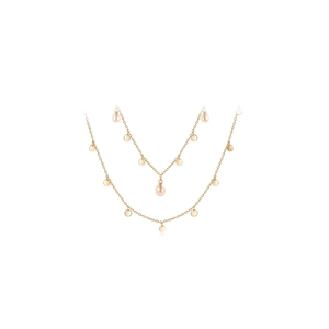 Close-up of double-layer gold necklace with sparkling round sequins and freshwater pearls