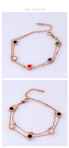Detail of rose gold double-layer bracelet with colorful enamel charms and lobster clasp