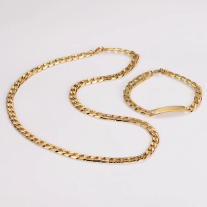 Detailed close-up of 7mm gold stainless steel curb chain set with flat identity plate