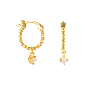 Detailed macro view of gold beaded hoop earrings with hanging clear zircon pendant stones