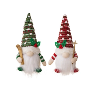 Set of two festive glowing Christmas gnomes with knitting hats and wooden ski accessories