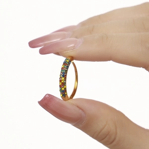18K gold plated stainless steel ring featuring colorful zircon crystals held by hand