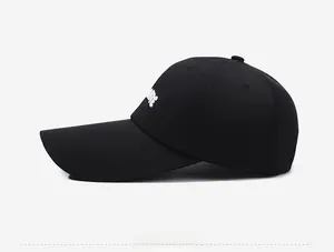 Side view of black long brim baseball cap with FUTURE white embroidery detail