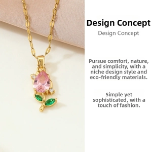 Detailed macro view of pink tulip flower pendant with green crystal leaves on gold chain