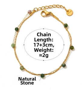 Detail of gold stainless steel bracelet featuring natural green stone beads and lobster clasp