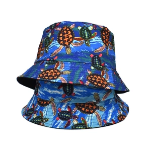 Blue reversible sun bucket hat with orange turtle prints on durable canvas material
