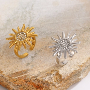Detailed view of adjustable sunflower ring with sparkling rhinestones in gold and silver