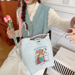 Quilted light blue crossbody bag with cute cartoon illustrations and large capacity design