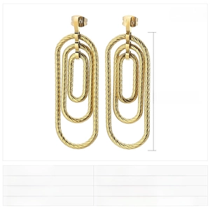 Detail of gold spiral-textured stainless steel triple oval earrings, size 43x17mm