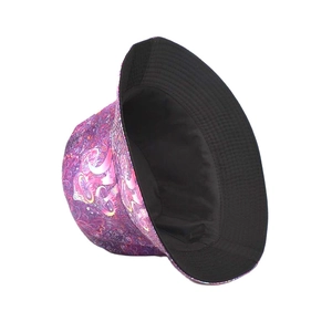 Detail view of mushroom pattern bucket hat showing vibrant print and black lining