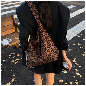 Close-up of leopard print oversized hobo tote bag with soft texture for fall fashion