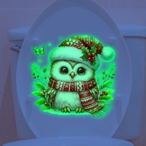 Sticker hibou fluorescent pour toilettes avec bonnet de Noël sur abattant blanc