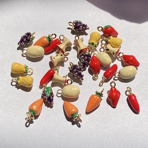 Detailed view of colorful alloy enamel fruit and vegetable charms for DIY jewelry making