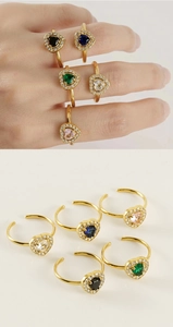 Detail of adjustable double-layer gold rings with colorful heart-shaped zircon stones