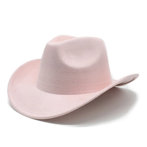 Detail of a pink suede western cowboy hat with curved brim and indented crown shape