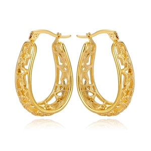 Elegant gold U-shaped hoop earrings featuring hollow star patterns in polished steel