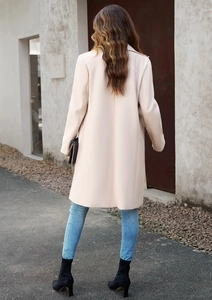 Back view of a minimalist beige mid-length wool coat with clean cut for professional commute