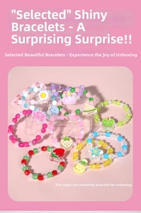 Detailed set of colorful beaded children's bracelets with strawberry and star charms