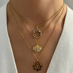 Three-layer gold necklace set with star-moon pendant and shell rhinestone charms