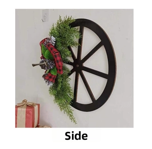 Side view of rustic carriage wheel Christmas wreath with pine cones and red plaid bow