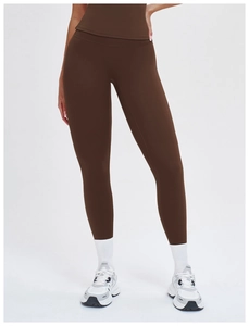 Close-up of deep brown high-waisted yoga leggings with matte high-stretch fabric texture