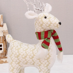 Christmas reindeer figurine in beige fabric with gold snowflakes and red-green striped scarf