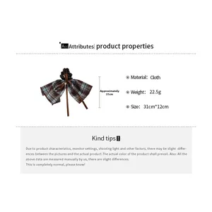 Detail showing product dimensions and weight of the brown plaid bow hair scrunchie